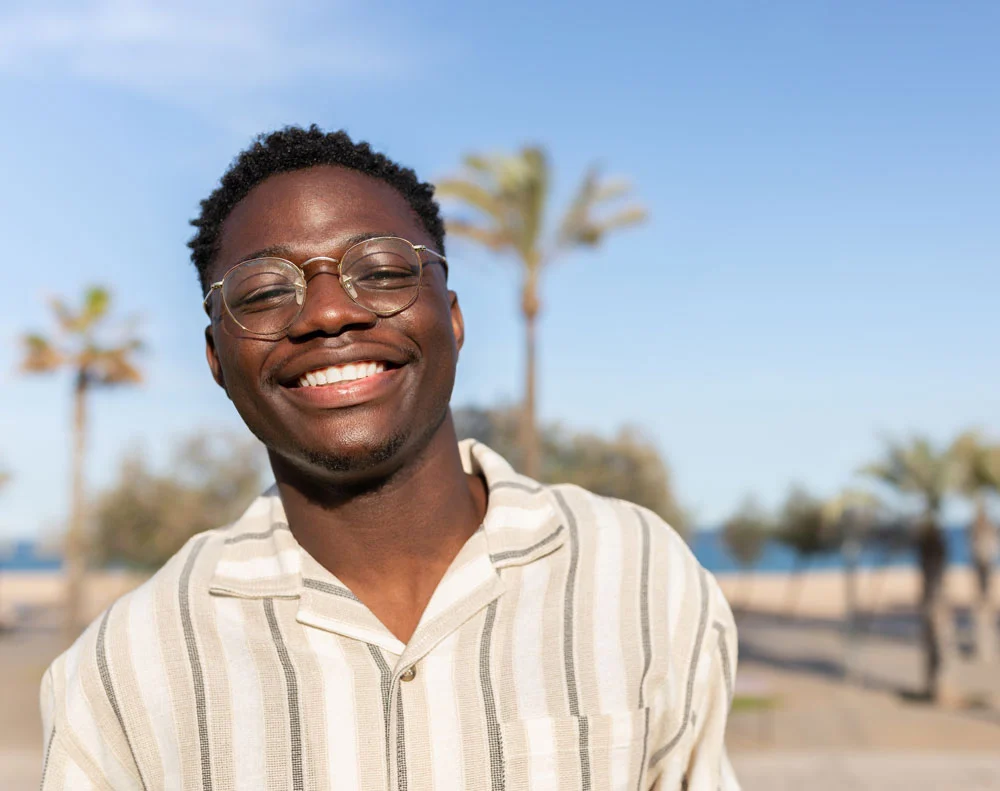 Glasses for Kids in Los Angeles, CA Portrait,of,young,happy,and,smiling,black,man,wearing,glasses